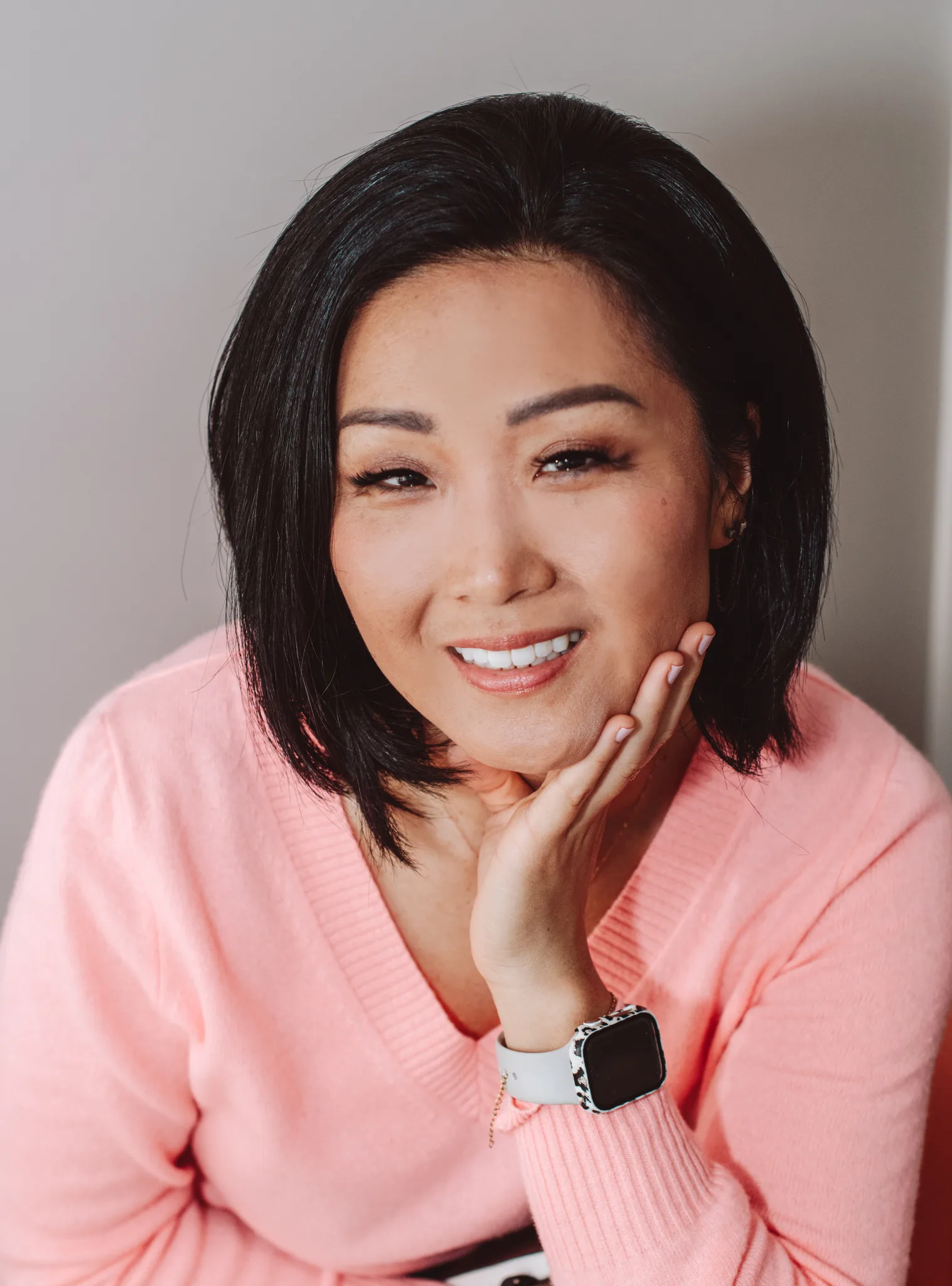 Irene Kim, owner of Kindled Life, smiling warmly